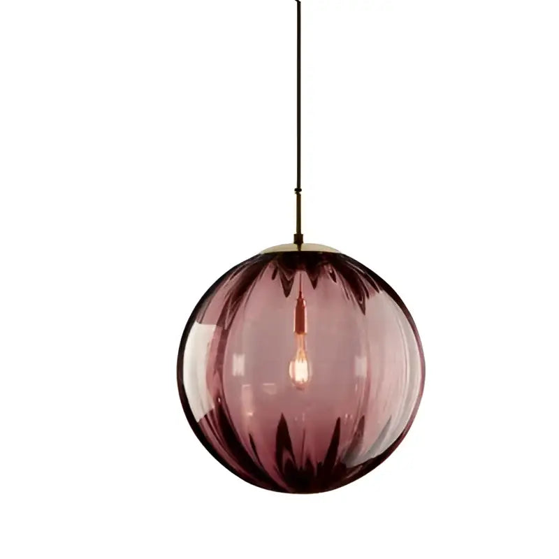 A deep purple textured glass ball pendant light with brass fixture for living room by decorbites glass ball