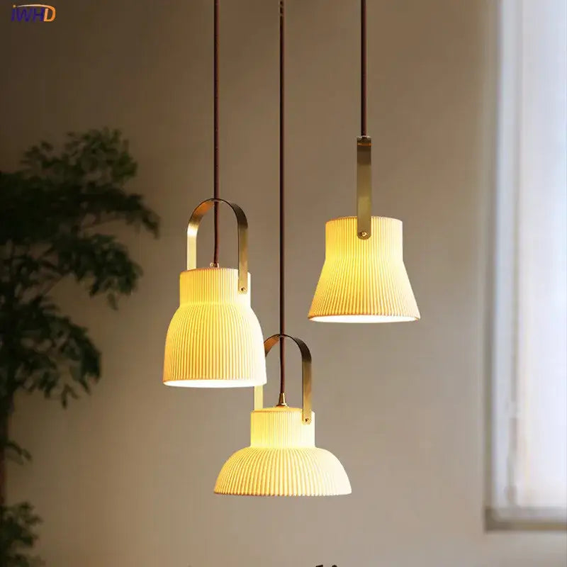 Three ribbed cream ceramic led pendant lights with brass accents hang from dark cords in kitchen decorbites ceramic led pendant design