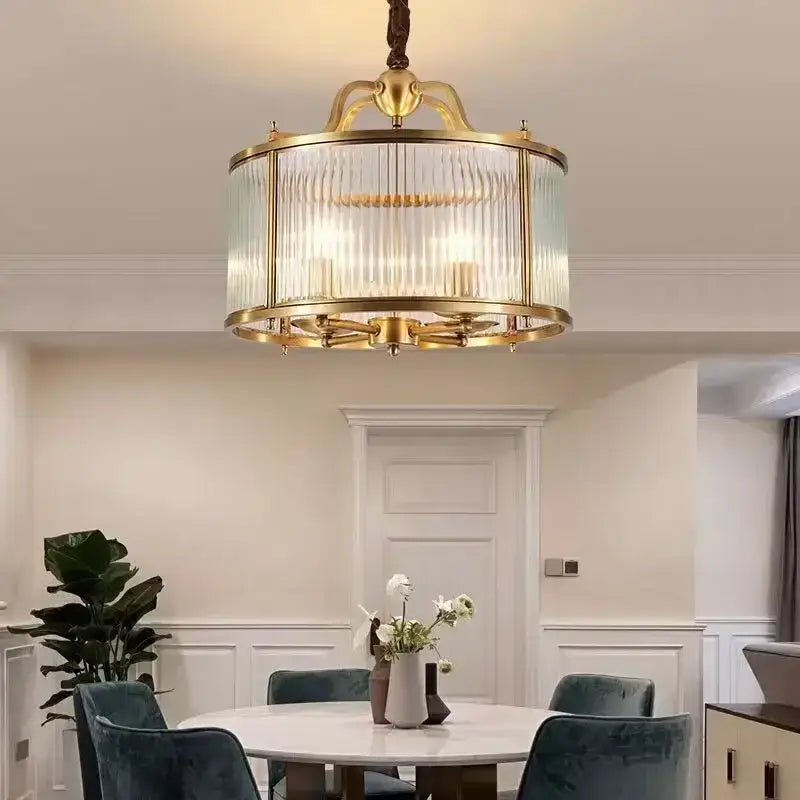 Brass-framed decorbites glass chandelier with ribbed vertical panels and warm glowing lights for living room pendant light