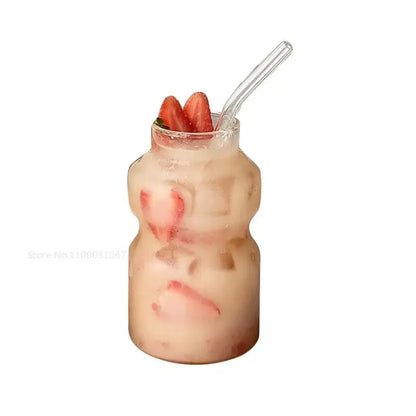 Clear glass ribbed frosted borosilicate glass cups filled with iced strawberry beverage garnished with fresh strawberries
