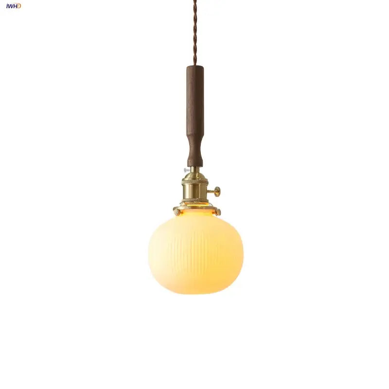 Warm-toned ribbed glass ceramic led pendant lamp with walnut handle and brass hardware for dining room decorbites ceramic led