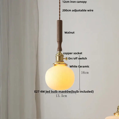 Warm glowing white ceramic led pendant lamp with ribbed glass globe, brass copper socket, and walnut wooden canopy