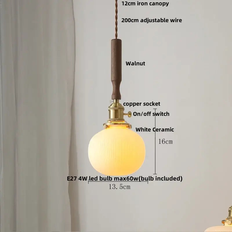 Warm glowing white ceramic led pendant lamp with ribbed glass globe, brass copper socket, and walnut wooden canopy