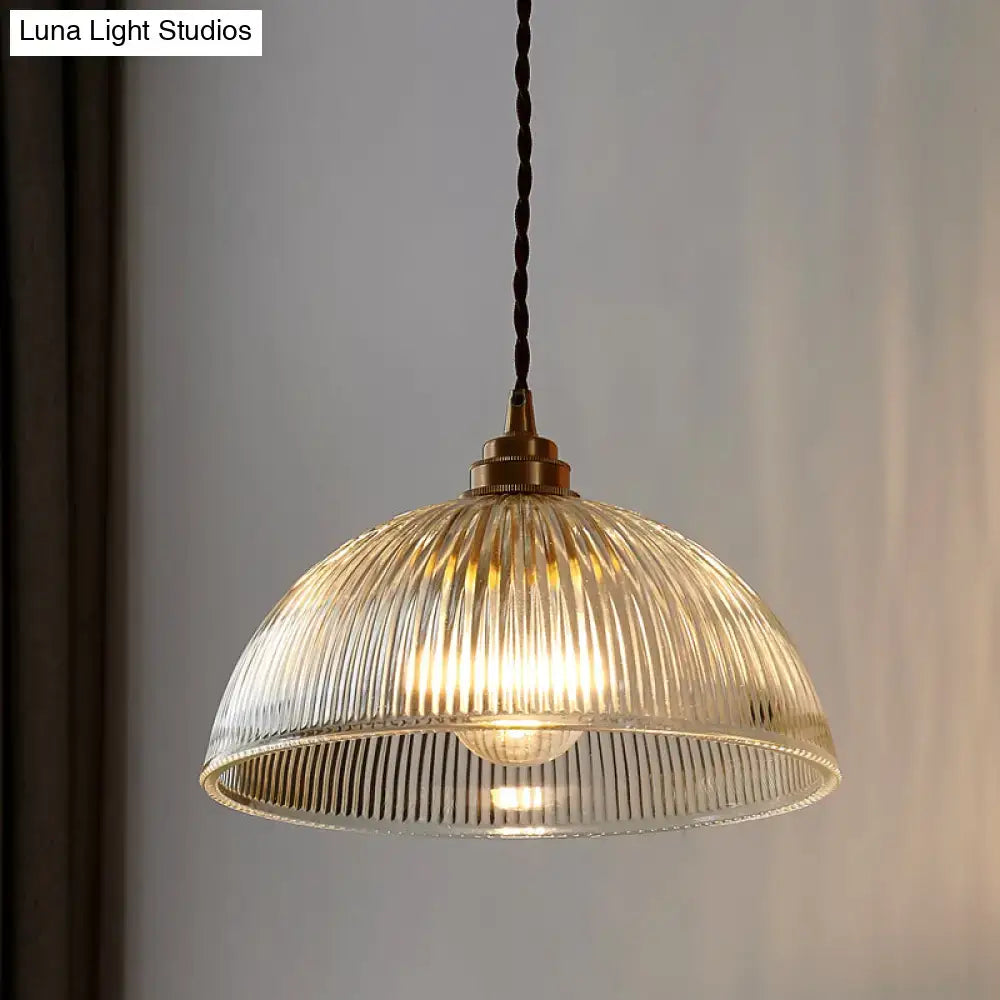 DecorBites™ ribbed glass pendant light with brass fixture and black cord designed for dining room lighting