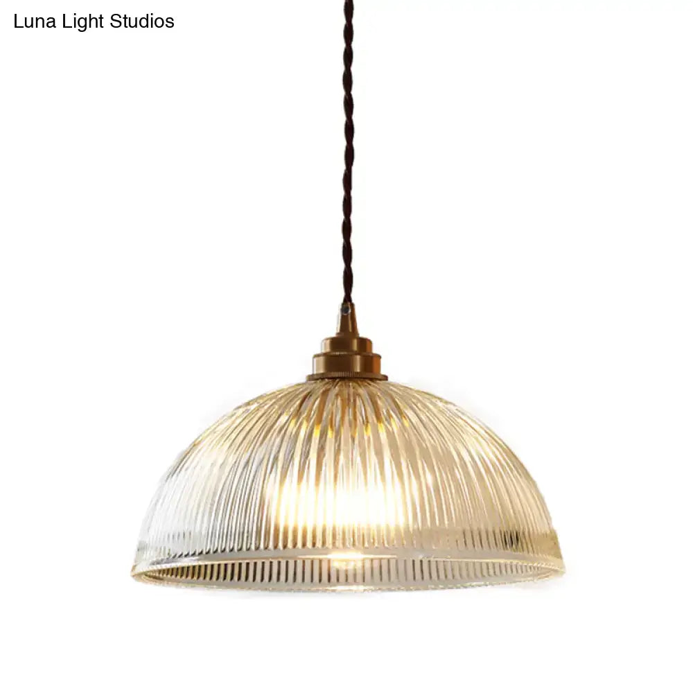 DecorBites™ ribbed glass pendant light with brass fixture and twisted dark cord for warm dining room lighting
