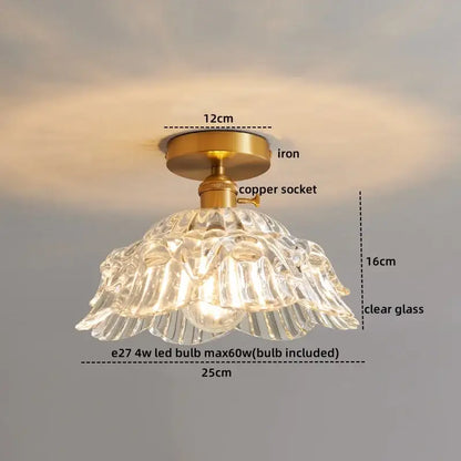 A clear glass copper led ceiling light with ribbed fluted design and brass iron mounting for dining room chandelier