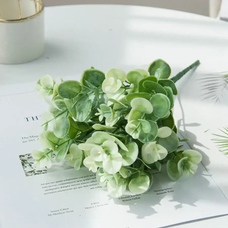 Ribbed glass eucalyptus leaves vase with delicate artificial soft green and pale cream synthetic eucalyptus leaves for decor