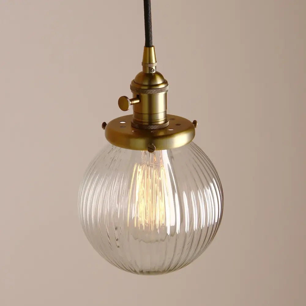 Vintage-style pendant light with clear ribbed glass globe and brass fixture ideal for living room decorbites clear glass globe