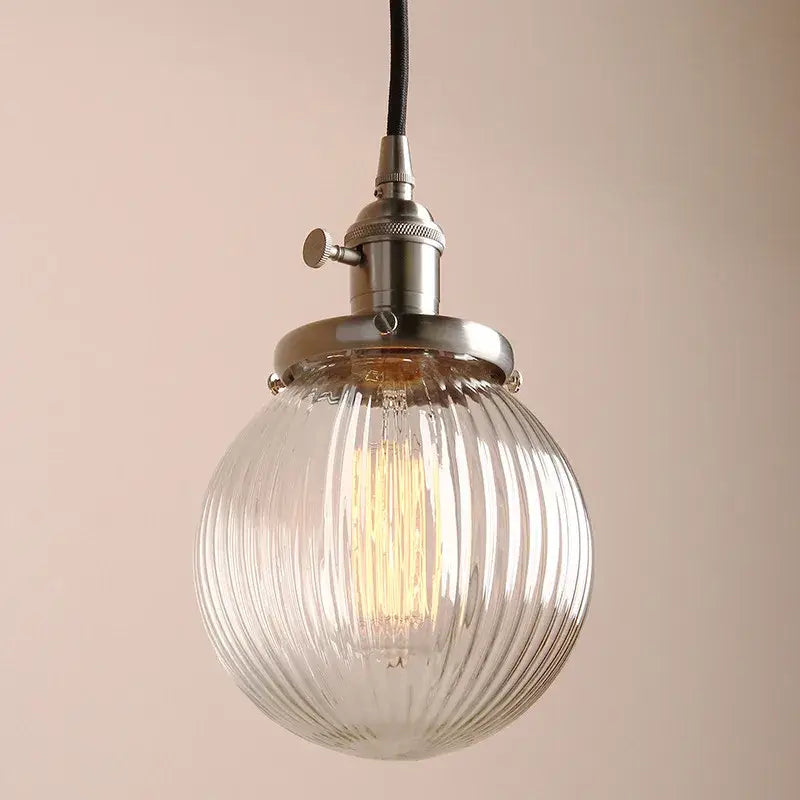 Ribbed clear glass globe pendant light with brass fixture and exposed Edison bulb for living room decorbites clear glass