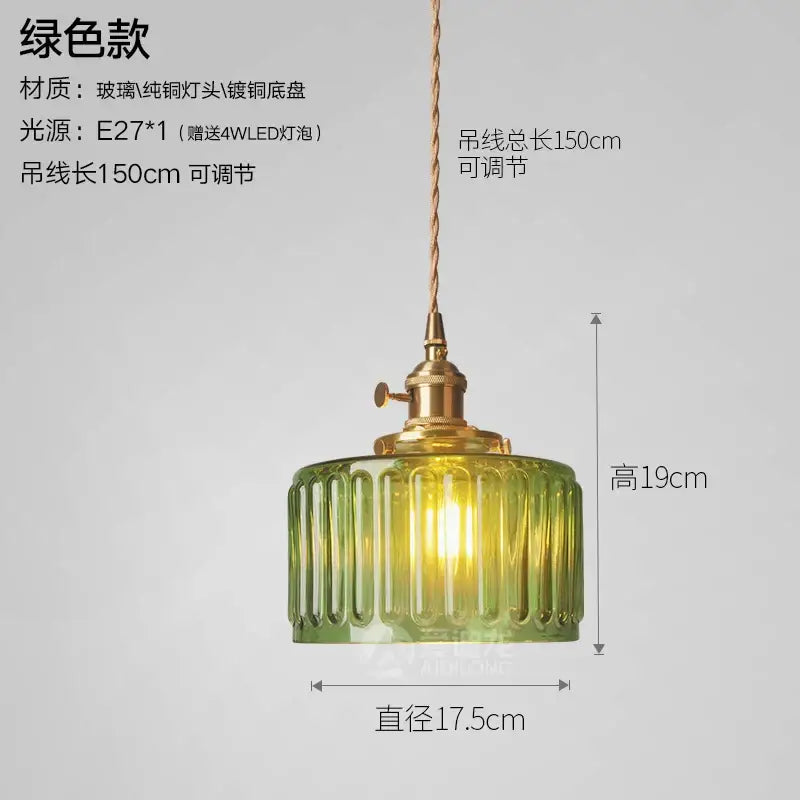 Green ribbed glass pendant light with brass fixture and adjustable cord for bedroom use in a glass pendant light design