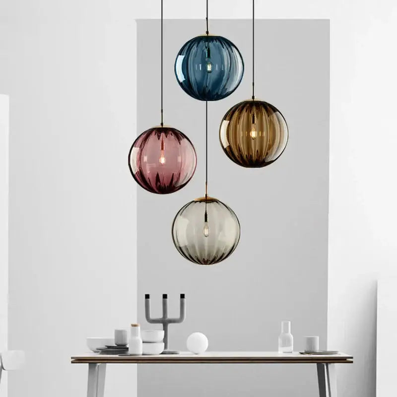 Set of four ribbed multi color glass globe pendant lights in iron finish for dining room with gradient hues
