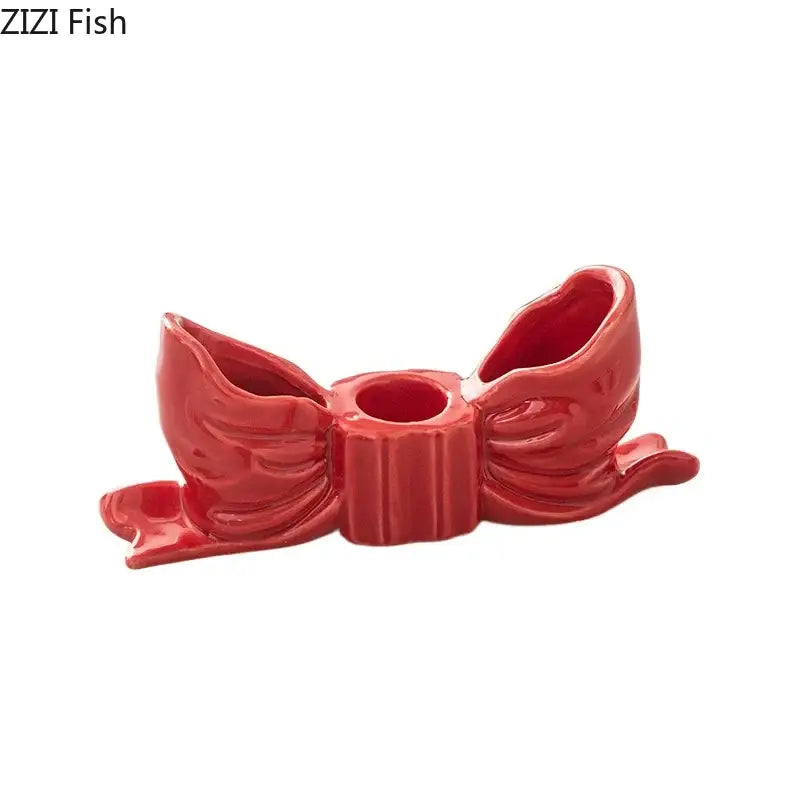 Vibrant red ceramic bowknot candle holder with glossy finish and detailed ribbon folds for bedroom desk decorbites candle holder