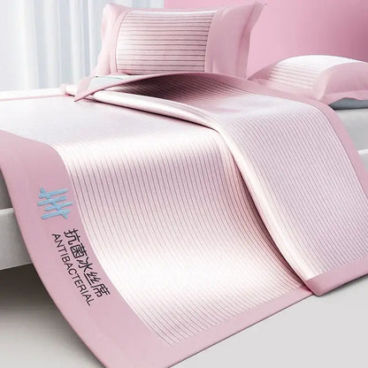 Pink antibacterial cooling bed mat set with ribbed texture and soft satin-like finish for bedroom use