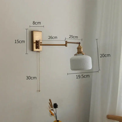 White ribbed ceramic wall sconce with brass swing arm and decorbites brass swing wall mount for bedroom light
