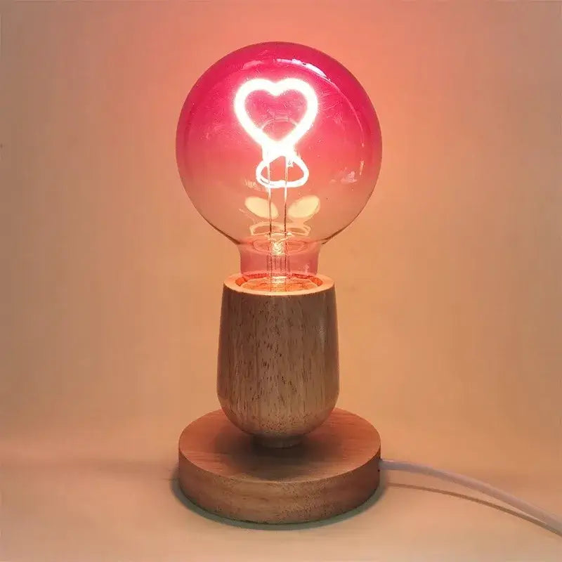 Romantic gradient pink led filament heart light bulb with warm glow in minimalist wooden base for decorbites gradient pink decor
