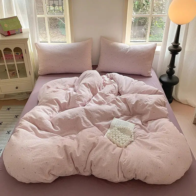Romantic pink cotton flower print bedding set featuring a pink corduroy duvet with subtle dot pattern for bedroom decor