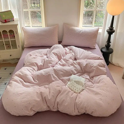 Romantic pink cotton flower print bedding set featuring a pink corduroy duvet with subtle dot pattern for bedroom decor