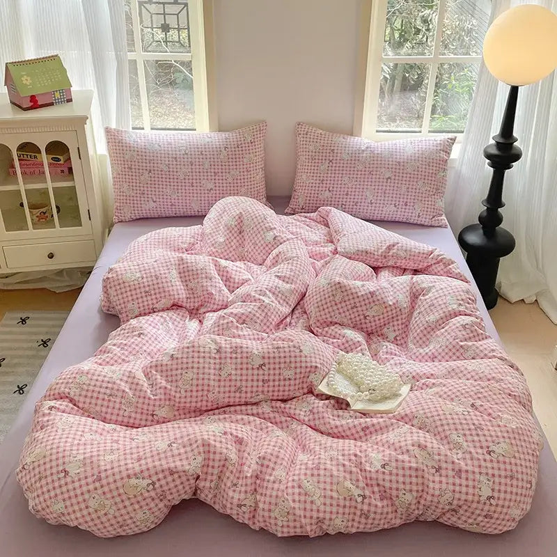 Romantic pink cotton flower print bedding set featuring a pink gingham duvet with small white cartoon animal prints