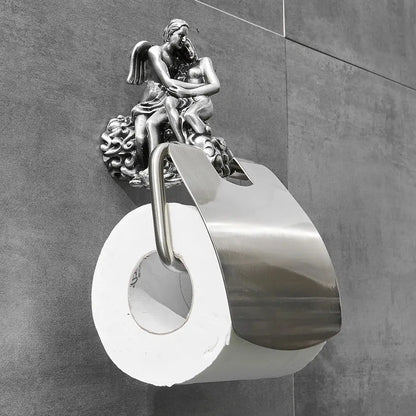 Silver angel-themed toilet paper holder with ornate sculpted design and polished finish in romantic bathroom hardware set