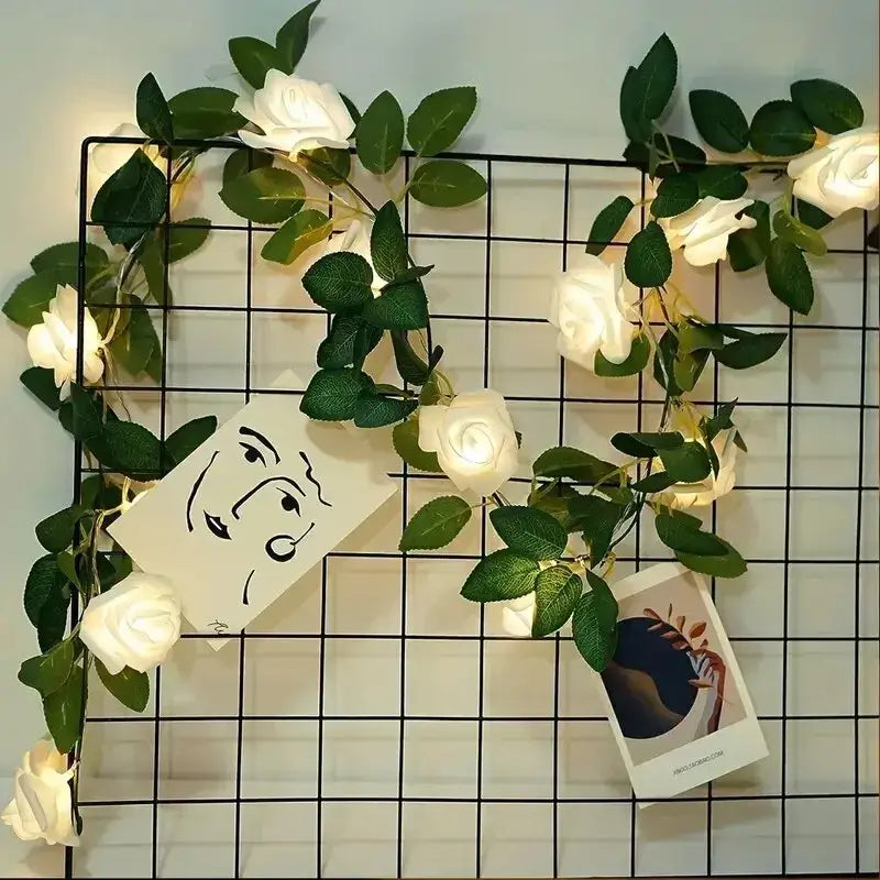White artificial rose flower string lights garland with green leaves and integrated led for wedding décor