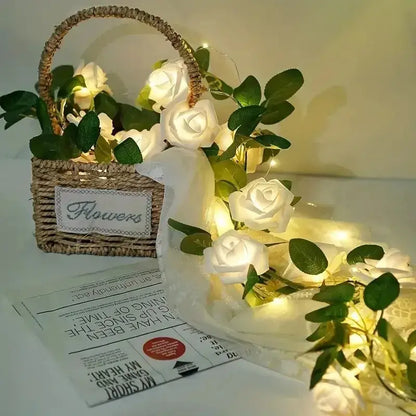A woven wicker basket with handle and a flowers label holding decorbites rose flower string lights battery powered lamp