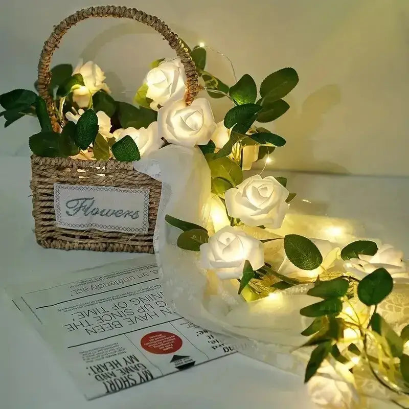 A woven wicker basket with handle and a flowers label holding decorbites rose flower string lights battery powered lamp