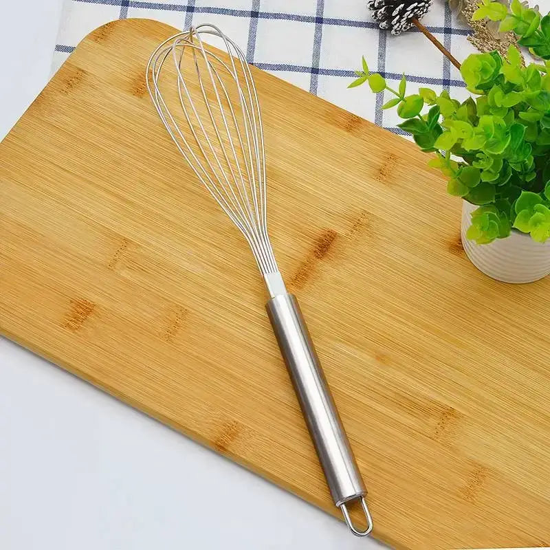 Stainless steel wire egg beater with sleek cylindrical handle in rose gold and brass decorbites gold steel kitchen set