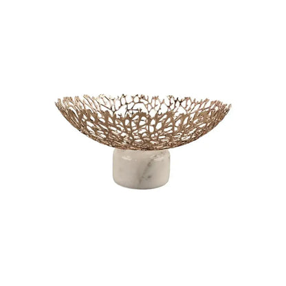 Rose gold decorbites coral disc pedestal fruit bowl with intricate lace-like metal design on white marble base for dining room decor