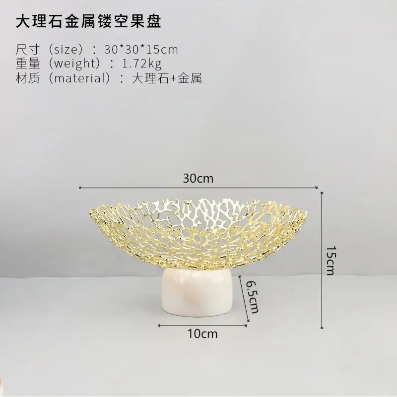 Rose gold coral disc pedestal marble fruit bowl with gold-toned metal lattice and white marble base decorbites coral disc