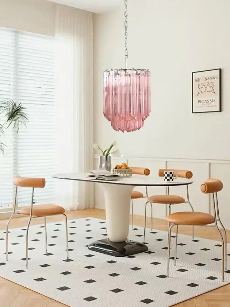 Rose gold pink glass chandelier with cascading cylindrical design hanging from chain for living room lighting