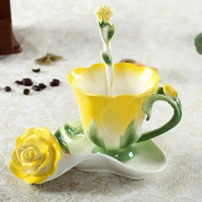A glossy yellow enamel rose peony ceramic spoon with rose-shaped handle beside a matching peony floral coffee cup set