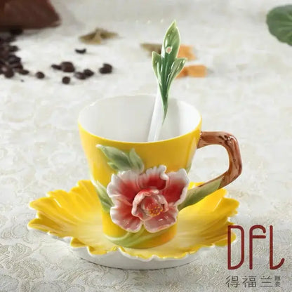 A vibrant yellow ceramic rose peony floral teacup set with sculpted flower design and leaf-shaped matching saucer for dining room