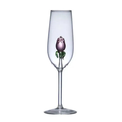 A clear glass rose stemware wine glass with a hand-blown purple decorbites 3d rose and green leaves in the stem