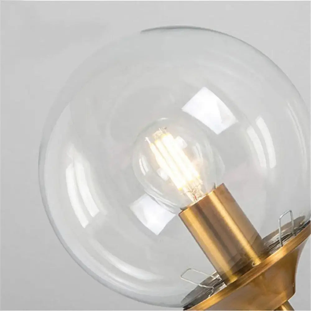 Round clear glass lamp shade replacement with brass base and illuminated edison filament bulb for living room decorbites clear glass