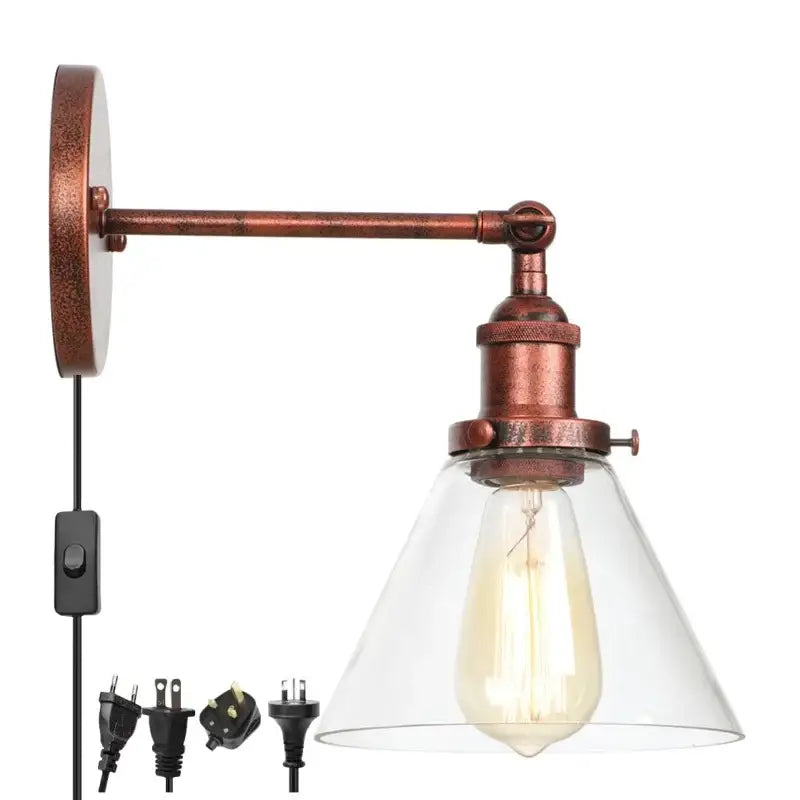 Rustic antique copper clear glass wall sconce with copper metal arm and clear glass shade featuring edison bulb decorbites clear glass