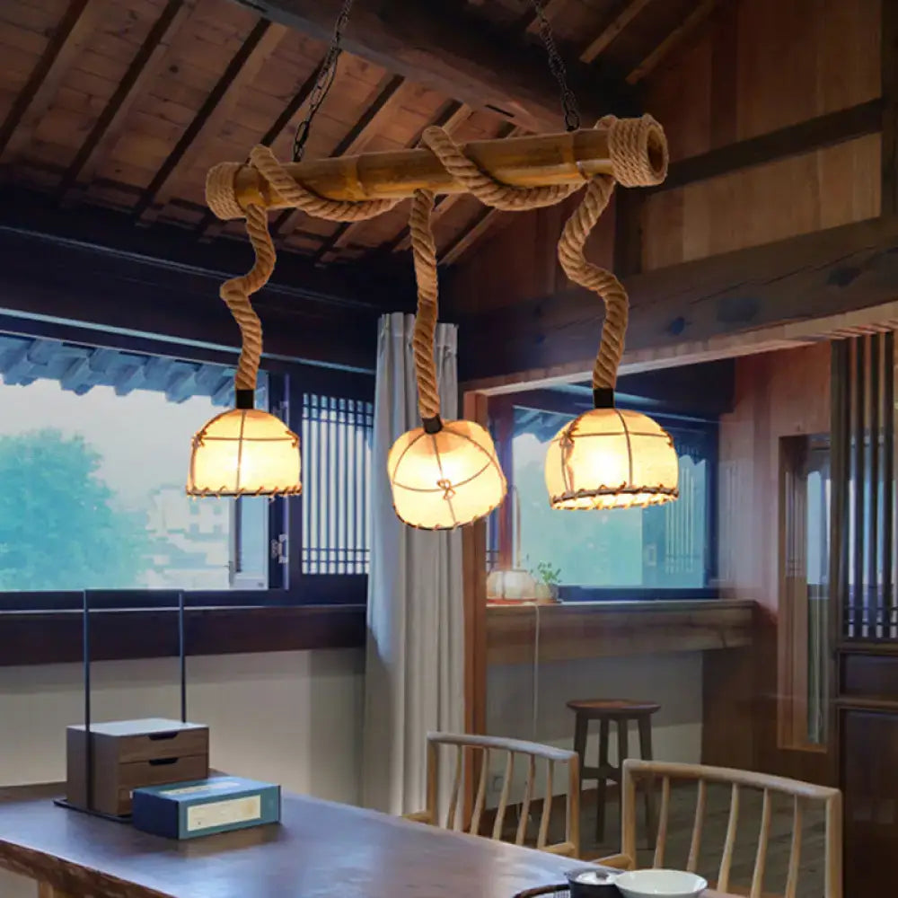Rustic DecorBites™ lodge style island pendant light with three fabric dome lanterns and beige hemp rope chain cord length