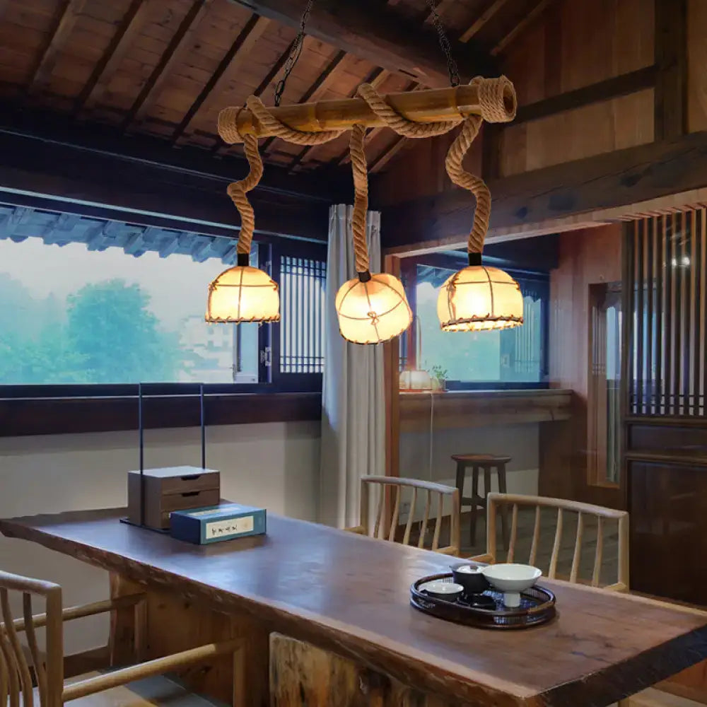 Rustic bamboo linear island pendant light with three beige paper lanterns suspended by thick rope 220v-240v 110v-120v