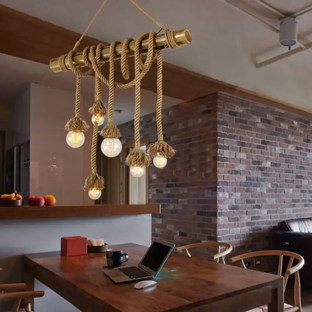 Rustic brass pipe pendant island light with adjustable beige rope and exposed bulb fixtures rope island light