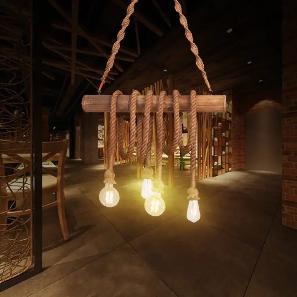 Rustic decorbites™ adjustable rope island light in beige with wooden beam, thick braided rope, and exposed Edison bulbs