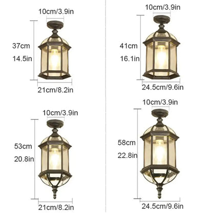 Four rustic outdoor hanging lanterns with black metal frames and warm glowing lights for decorbites black rustic patios