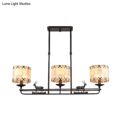 Rustic black metal deer chandelier with three beige barrel shade shape lampshades featuring tree silhouettes