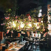 DecorBites™ black metal industrial four heads island lamp with pink roses and warm lights for restaurant use