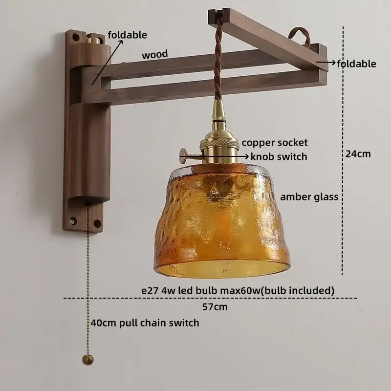 Rustic brass and clear glass wall sconce with foldable wooden arm amber shade and 40cm pull chain decorbites clear glass