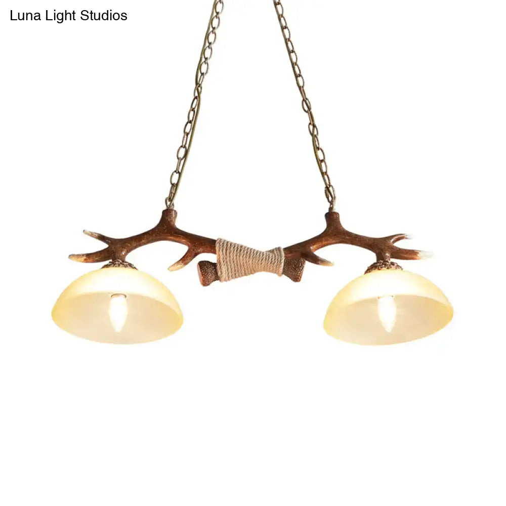 DecorBites brown glass island lamp with antler-themed rustic metal frame and two warm glass shades suspension light