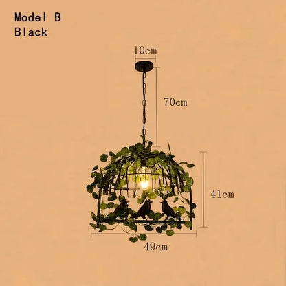 Rustic bronze black metal bird cage chandelier with green leaf bird vines and three silhouetted birds for dining room
