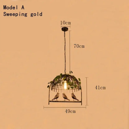 Rustic bronze bird cage chandelier with sweeping gold pendant light featuring three birds and green leaf accents