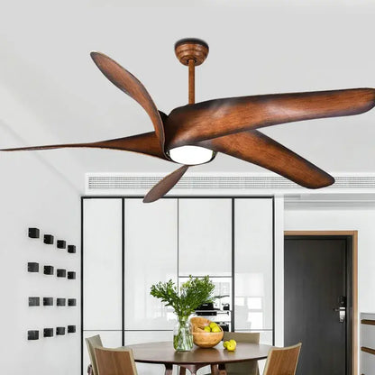 A modern ceiling fan with five wide brown wooden blades and a central light fixture with remote control