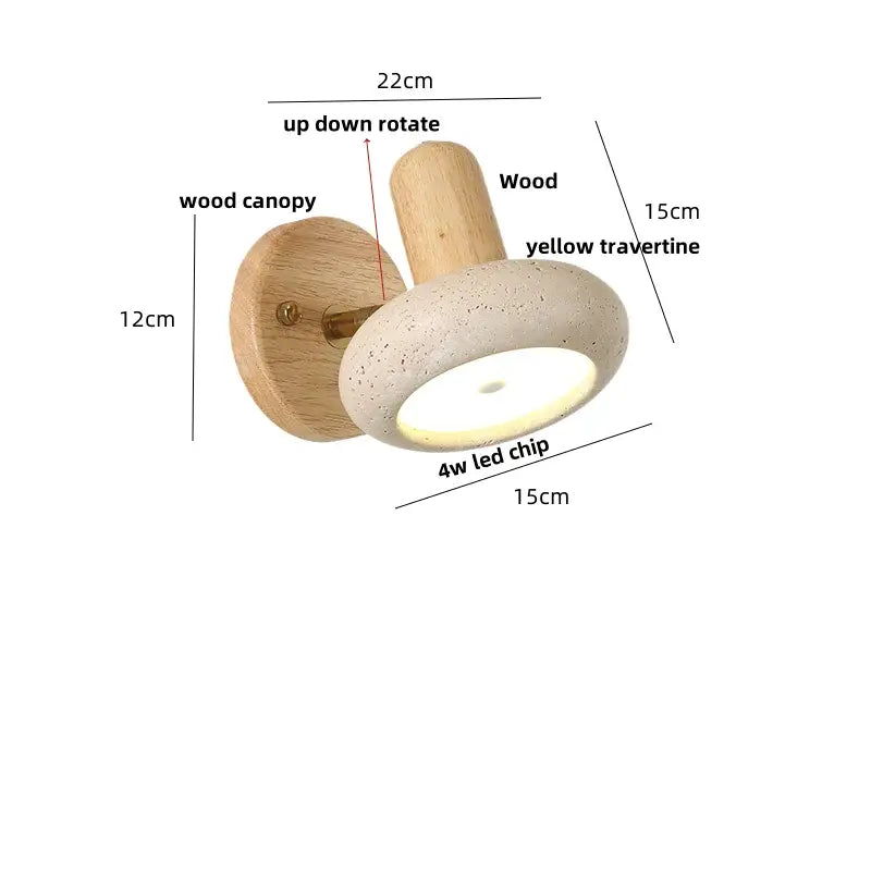 A modern led wall sconce with a light wood canopy and yellow travertine shade featuring an up-down rotating design
