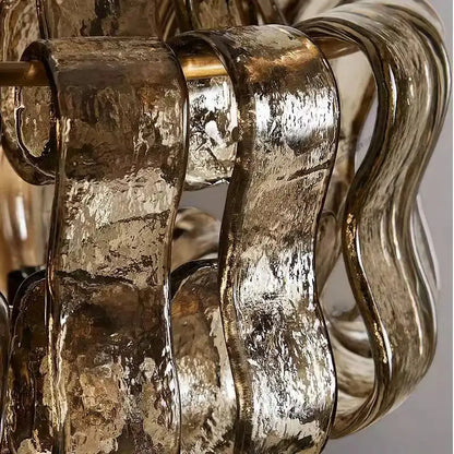 Rustic dark brown glass wall sconce lamps featuring a sculptural chandelier design with hammered gold and silver shades