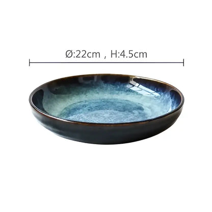Rustic decorbites ceramic salad bowl with a deep blue speckled gradient glaze and raised edges for dining room use
